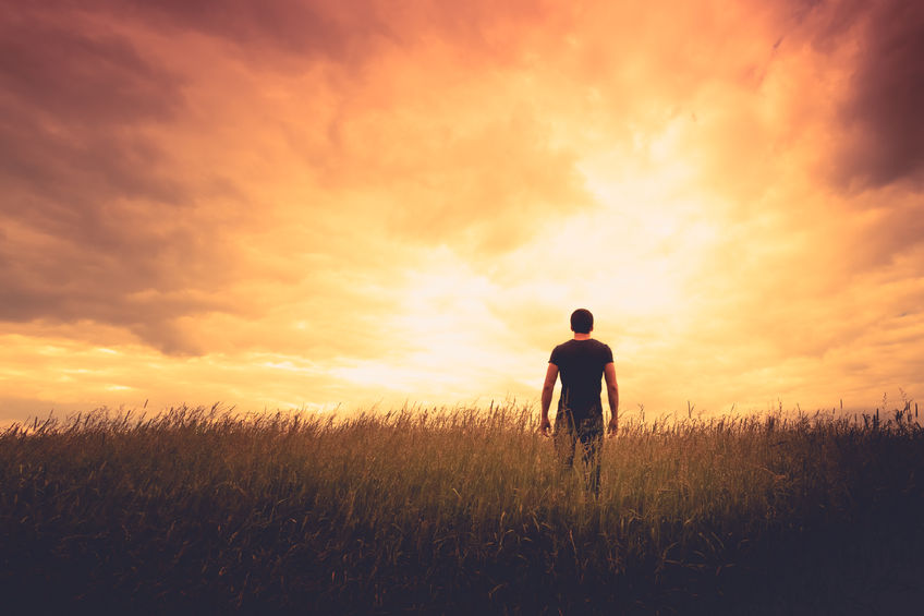 Help My Unbelief - Bob Sawvelle - silhouette of man standing in a field at sunset