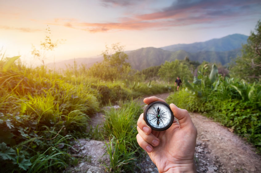 Destiny Discovered - Bob Sawvelle - hand holding compass looking to path ahead