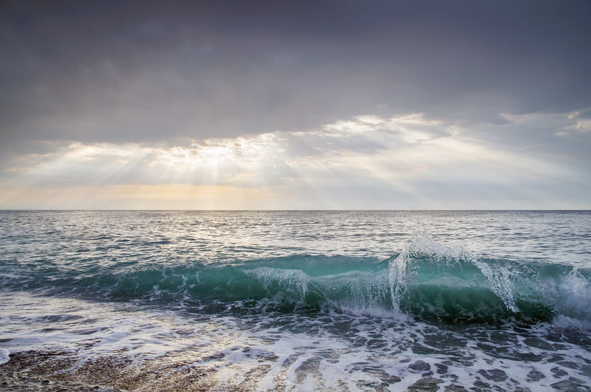 Faith vs Fear - Bob Sawvelle - Sea wave, and the sun's rays pass through the clouds